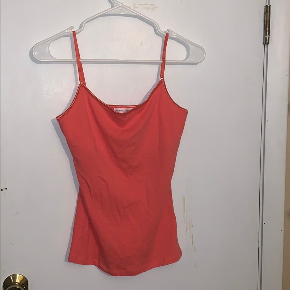 Peach sleeveless shirt.